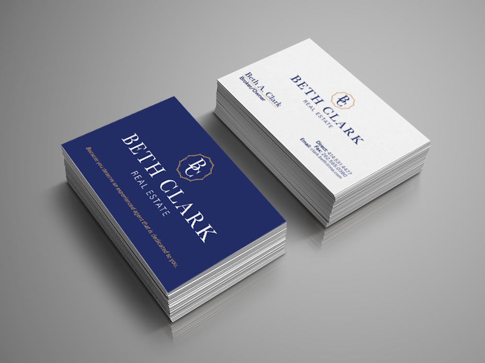 Two stacks of business cards showing print, graphic design, logo design, and branding for a real estate company