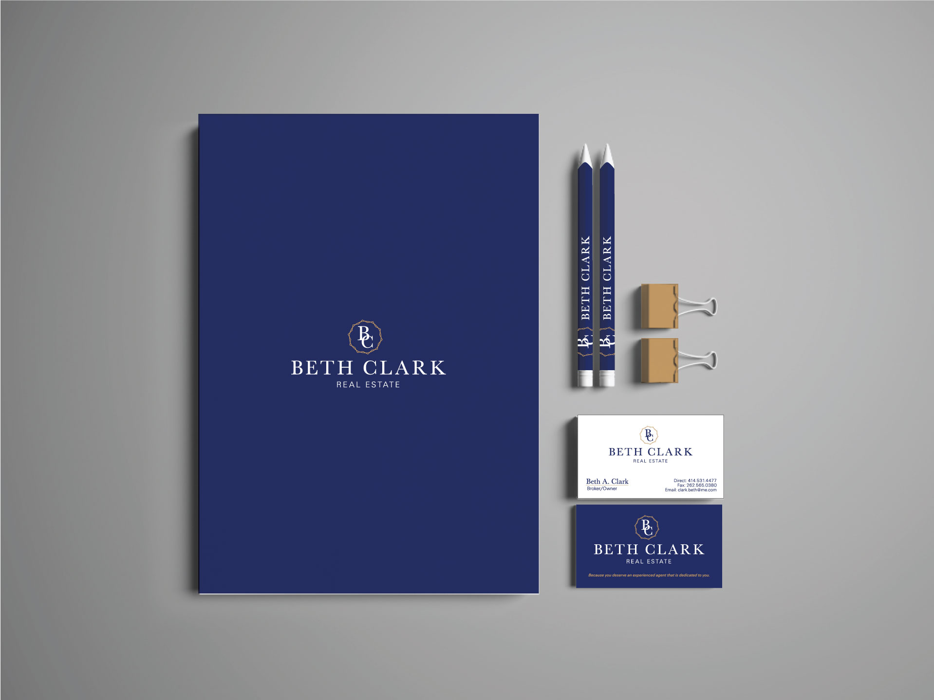 A folder, pencils, paper clips, and business cards used for advertising with printed logo and branding design